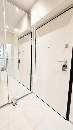 a bathroom with a shower and a glass door at Apartment ReLakes in Plitvička Jezera