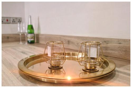 a tray with two candles on top of a table at The Grandeur Mill in Bradford