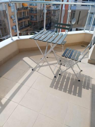 a bench on the balcony of a building at Beatris in Pomorie