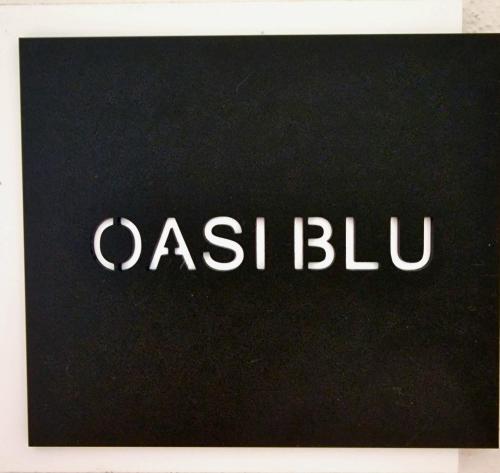 a sign with the word ash blub written on it at Oasi Blu Monolocale Vista Mare in Nebida