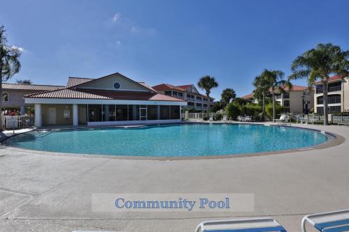 a swimming pool at a community pool at 2-2 Riverfront Condo At Bouchelle Island in New Smyrna Beach