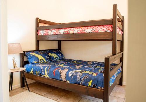 a bedroom with two bunk beds in a room at Camderest House in Graaff-Reinet