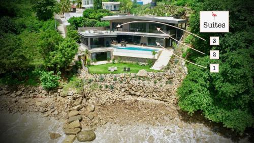 an aerial view of a house on a river at The Flamingo Experience in San Juan del Sur