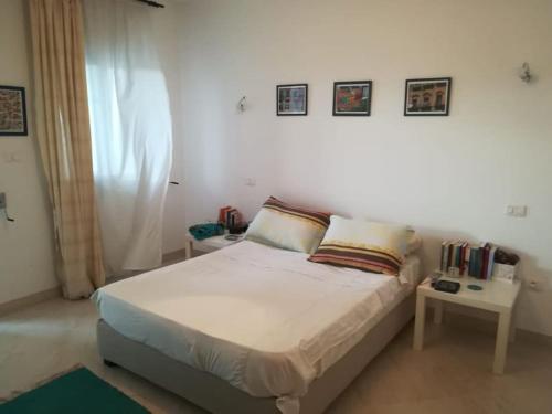 Ένα ή περισσότερα κρεβάτια σε δωμάτιο στο Joli duplex vue sur mer