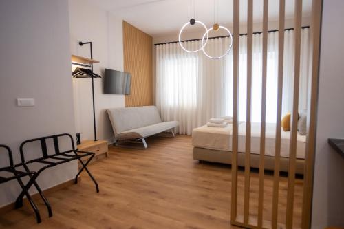Ένα ή περισσότερα κρεβάτια σε δωμάτιο στο Eudokia Pension