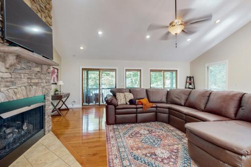 a living room with a couch and a fireplace at Hap's Sweet Hideaway in Maynardville