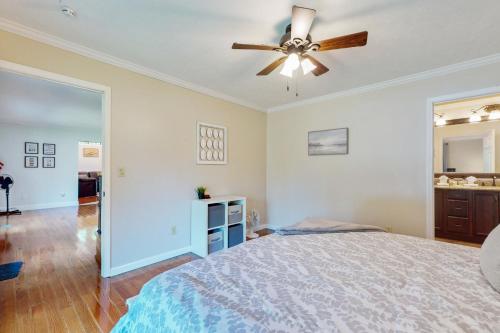 a bedroom with a bed and a ceiling fan at Hap's Sweet Hideaway in Maynardville