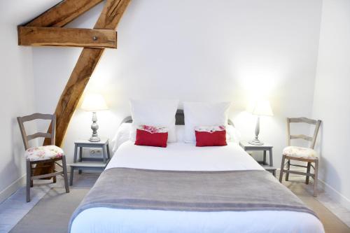 En eller flere senge i et værelse på Gîte avec piscine et jardin Le Cosy - Les Bergeronnettes Bergerac