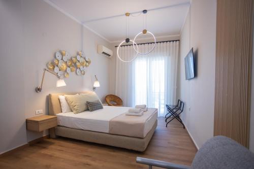 Ένα ή περισσότερα κρεβάτια σε δωμάτιο στο Eudokia Pension