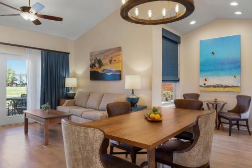 a living room with a table and a couch at Club Wyndham Pagosa in Pagosa Springs
