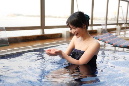 a young woman in a swimming pool at Ako Onsen Shokichi in Ako