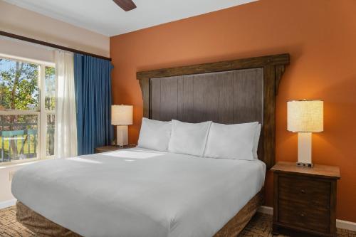 a bedroom with a large bed and a window at Club Wyndham Pagosa in Pagosa Springs