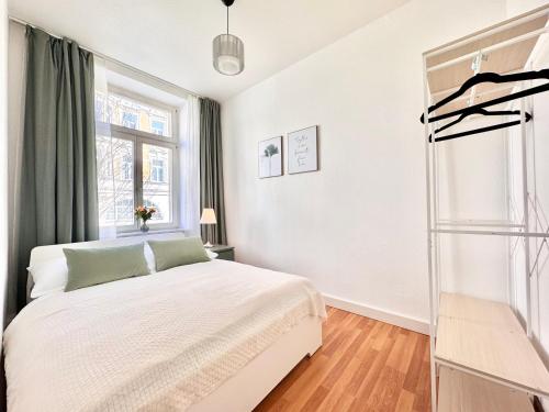 Ένα ή περισσότερα κρεβάτια σε δωμάτιο στο Altstadt Suite