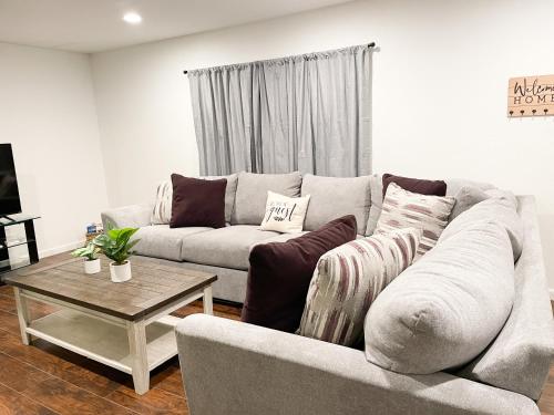 a living room with a couch and a coffee table at County Chic Pets Ok Tx Motor Speedway Nearby By Vacation Your Way in Fort Worth