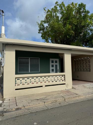 a building with a window and a fence at Casa Morales in Vieques