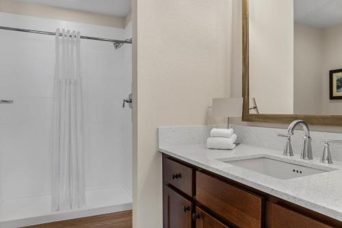 a bathroom with a sink and a shower at Club Wyndham Pagosa in Pagosa Springs