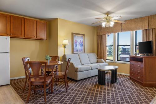 a living room with a couch and a table at Club Wyndham Pagosa in Pagosa Springs
