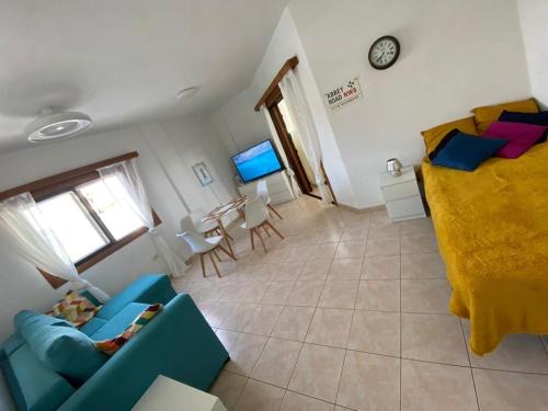 a living room with a couch and a bed at Sun Studio Tenerife in Arona
