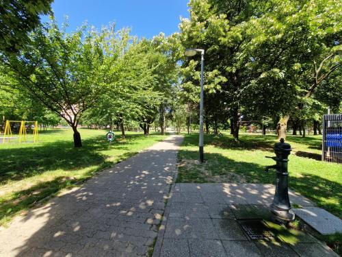 a path in a park with a street light at NEW - Frendly Luxury Apartment Franka Zagreb in Zagreb
