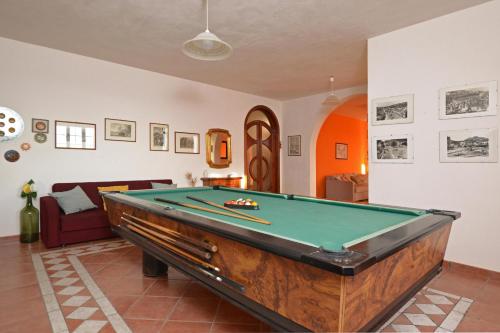 a living room with a pool table in it at Villa Torres - Happy Rentals in Scicli