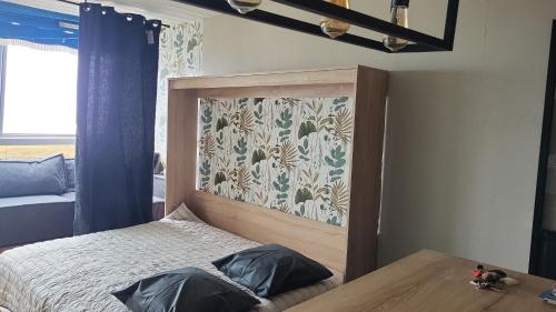 Ένα ή περισσότερα κρεβάτια σε δωμάτιο στο L escatade de Saint jean de monts