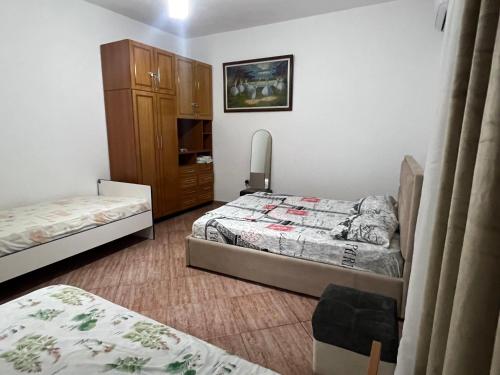 Postel nebo postele na pokoji v ubytování Mateo Villa Vlore