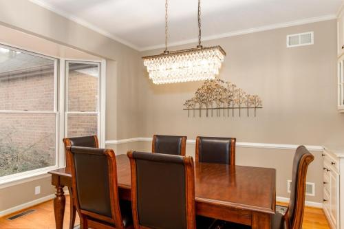 a dining room with a table and chairs at Secluded 4 bedroom with hot tub minutes from campus in State College