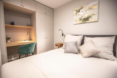 Ένα ή περισσότερα κρεβάτια σε δωμάτιο στο Navigare Apartments