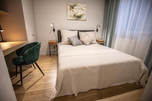 Ένα ή περισσότερα κρεβάτια σε δωμάτιο στο Navigare Apartments