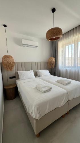Ένα ή περισσότερα κρεβάτια σε δωμάτιο στο Norte Luxury Villas