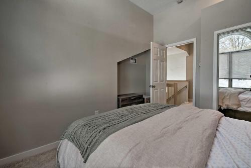 a bedroom with a large bed and a window at BigBoulder Lakeview Terrace-Minutes from the Lake in Lake Harmony