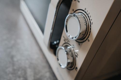 a close up of a stove with a mirror at Large cosy house - free on street parking in Liverpool