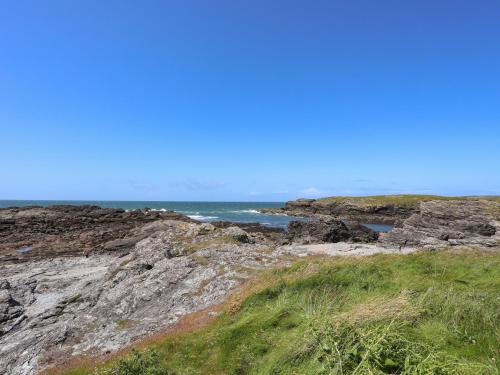 a view of the ocean from a rocky beach at Seaside Sanctuary in Holyhead