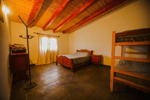 Postel nebo postele na pokoji v ubytování La casona de Quipón