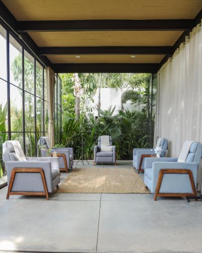 a group of chairs and tables on a patio at Soul Spring Sanctuary Cuernavaca in Xochitepec