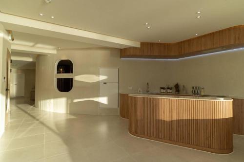 a large kitchen with a counter and a bar at The First Gwangan in Busan