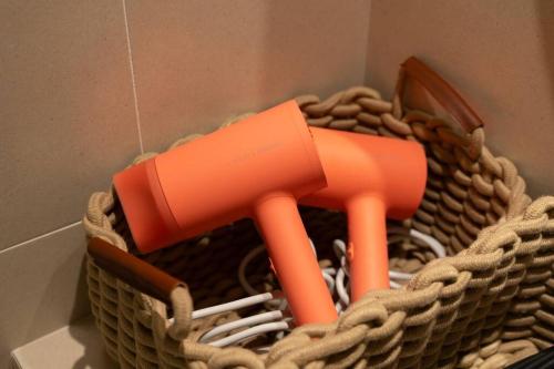 a basket with an orange object in it at The First Gwangan in Busan
