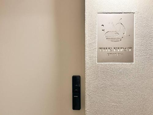 a white refrigerator with a picture of a lizard on it at The First Gwangan in Busan