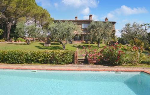 a house with a swimming pool in front of it at Scaterina in Monte San Savino