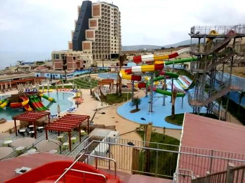 a water park with a water slide and slides at Appartement f2 Algérie skikda bouzaroura proche de la mère in Skikda
