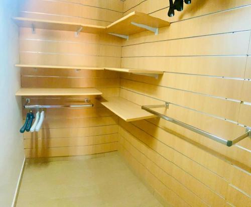 a walk in closet with wooden walls and shelves at Residenza La Rotonda in Vasto