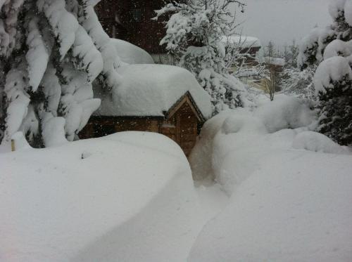 a pile of snow in front of a house at Appartement Asitz in Leogang