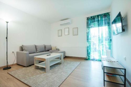 a living room with a couch and a table at Apartment Nina in Slunj