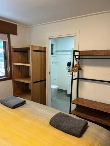a bedroom with a bed and a bathroom at Ripparoo Lodge in Falls Creek