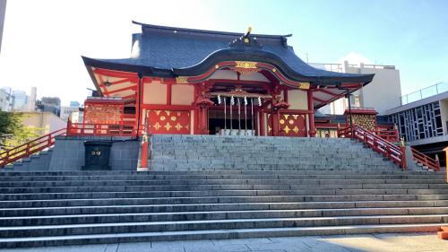 a building with stairs in front of a temple at Toyoko Inn Tokyo Shinjuku gyoemmae eki 3 ban Deguchi in Tokyo