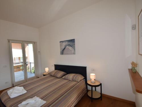 Katil atau katil-katil dalam bilik di Apartment in a prime location on Lake Maggiore