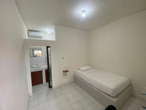 Postel nebo postele na pokoji v ubytování Ayodhya Guesthouse