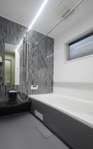 a bathroom with a shower and a sink at HANASTAY花渓居 椿Tsubaki in Osaka