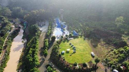 an aerial view of a park next to a river at Khu Du Lịch Tea Bobla Waterfall in Di Linh