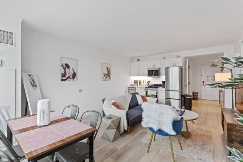a living room with a couch and a table at Sleep 6 Stylish 1BR 2BA Beachfront by CozySuites in Atlantic City
